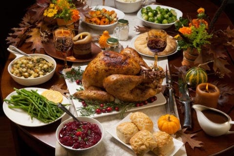 A delicious Thanksgiving meal with a turkey and all the trimmings.